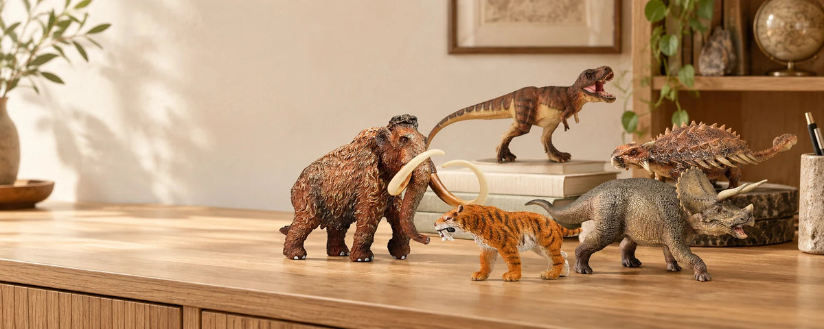 Faunov mammoth, T. rex, Triceratops, Smilodon and Ankylosaurus collectible figures displayed on a wooden tabletop at home