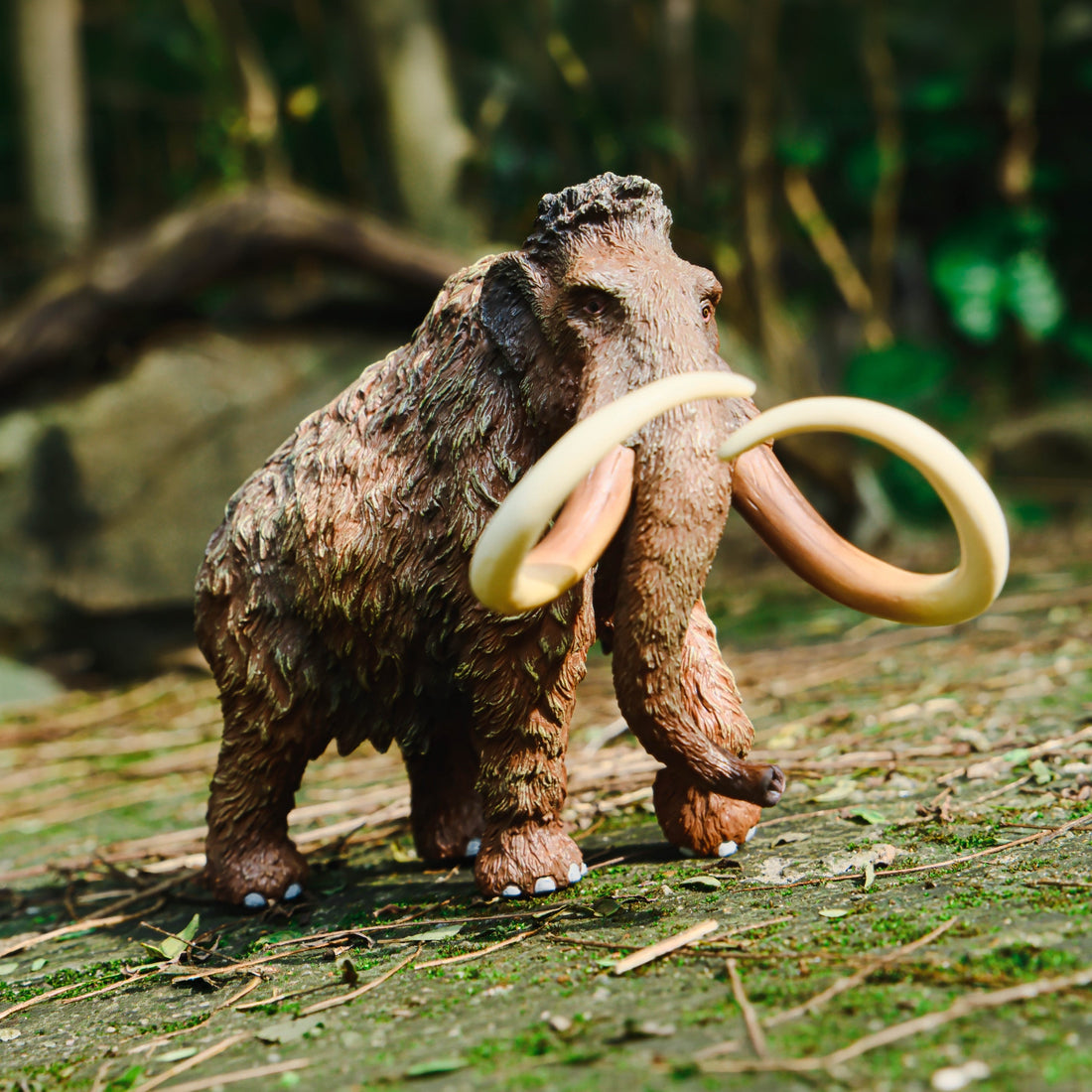 Woolly Mammoth Figure, displayed in a natural scene