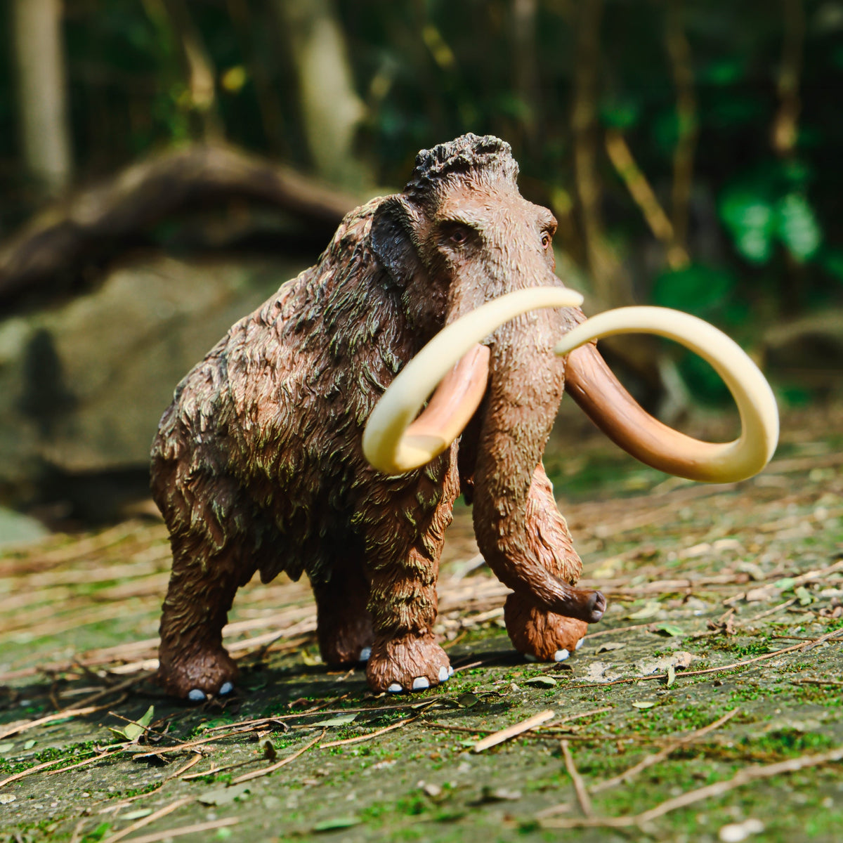 Woolly Mammoth Figure, displayed in a natural scene