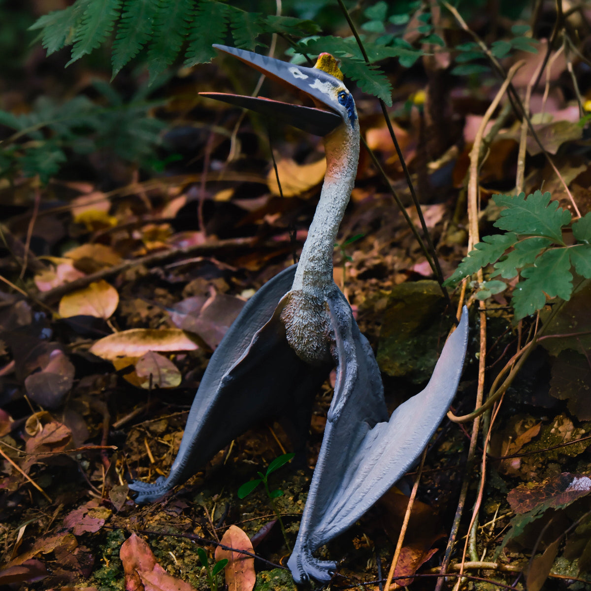 Blue Quetzalcoatlus Figure, displayed in a natural scene