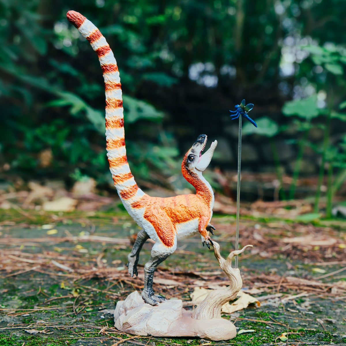 Sinosauropteryx Figure, displayed in a natural scene